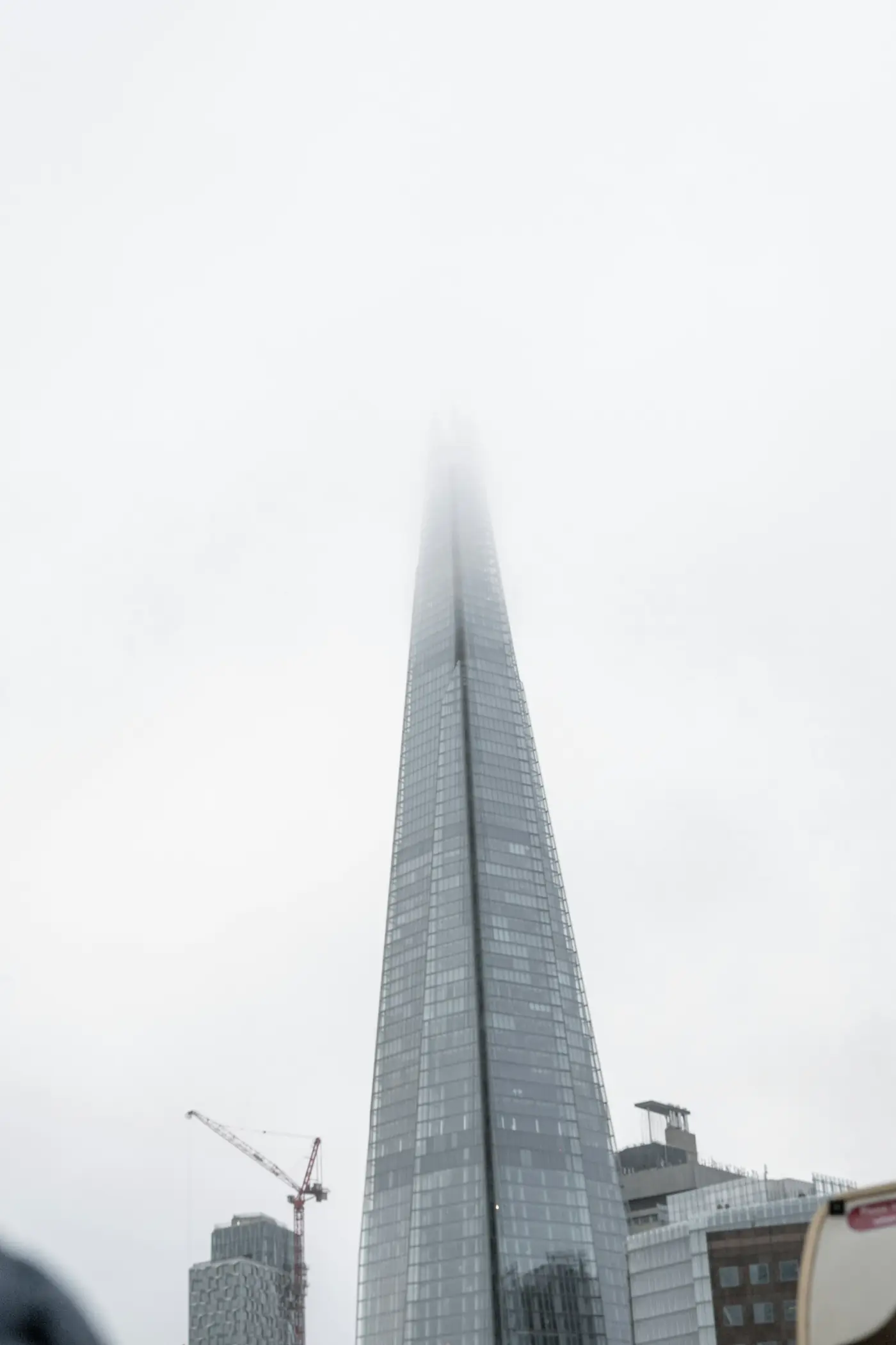 The Shard rising into low cloud above London Bridge